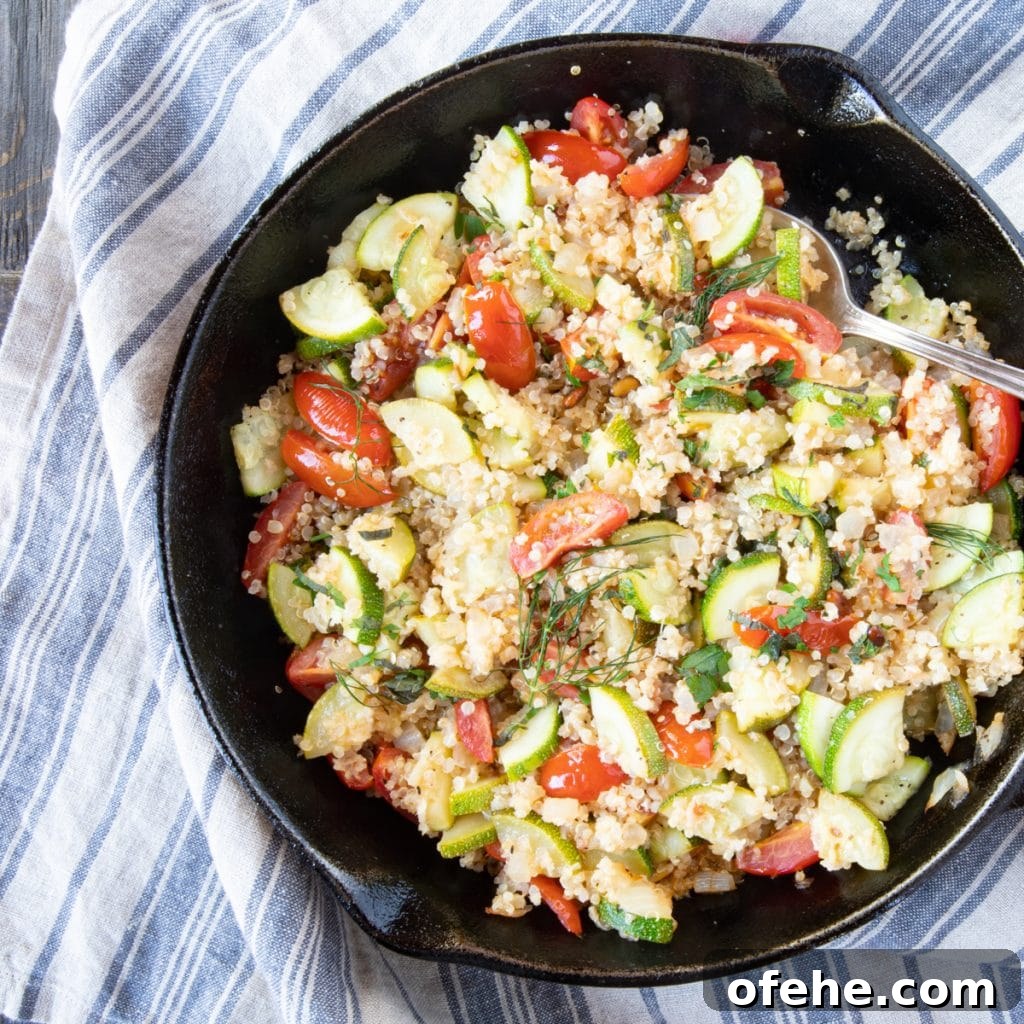 Quinoa salad with zucchini, tomatoes, and dill.