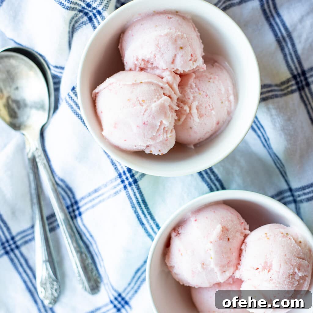 Two bowls of strawberry sherbet.