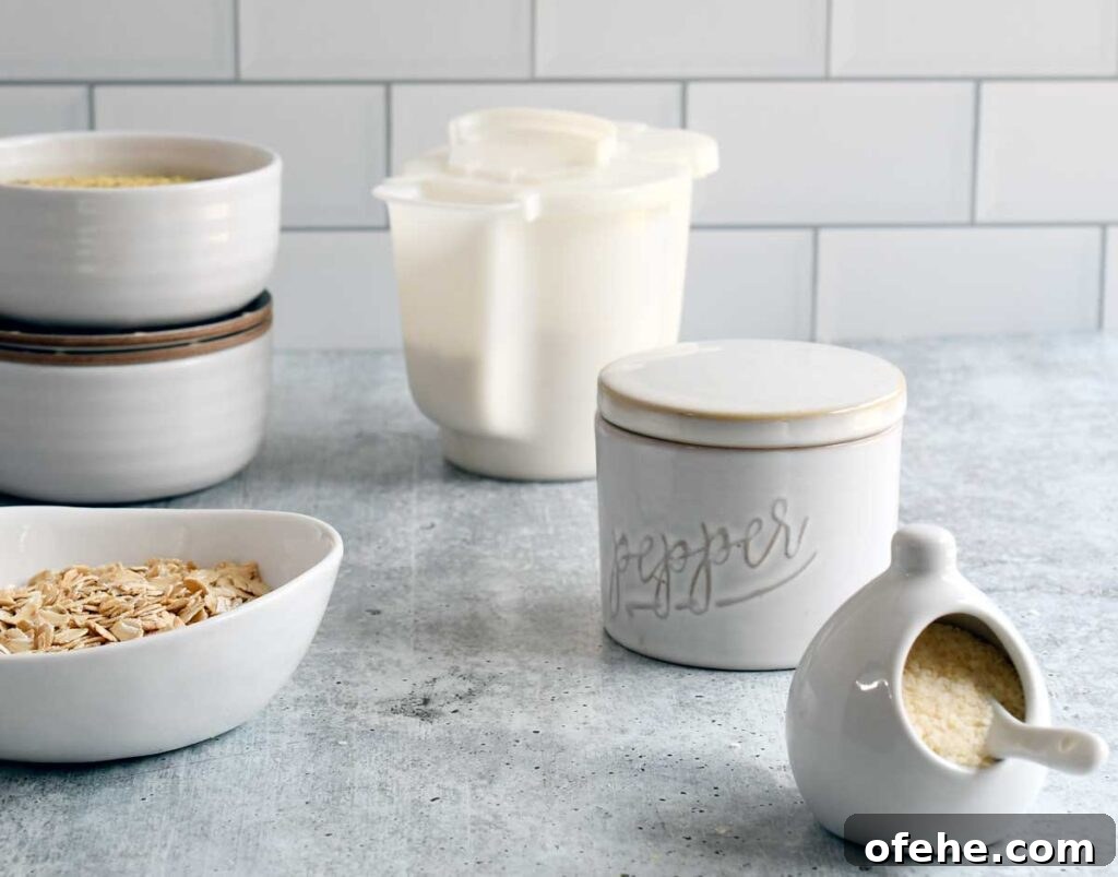 Gluten-Free Vegan White Gravy Mix Recipe (Oil-Free) 3 The gravy mix ingredients in small bowls on a concrete counter top.