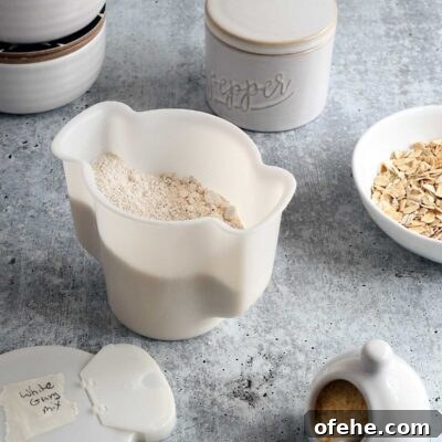 Gluten-Free Vegan White Gravy Mix Recipe (Oil-Free) 7 Homemade vegan country white gravy mix in a white tupperware contianer.
