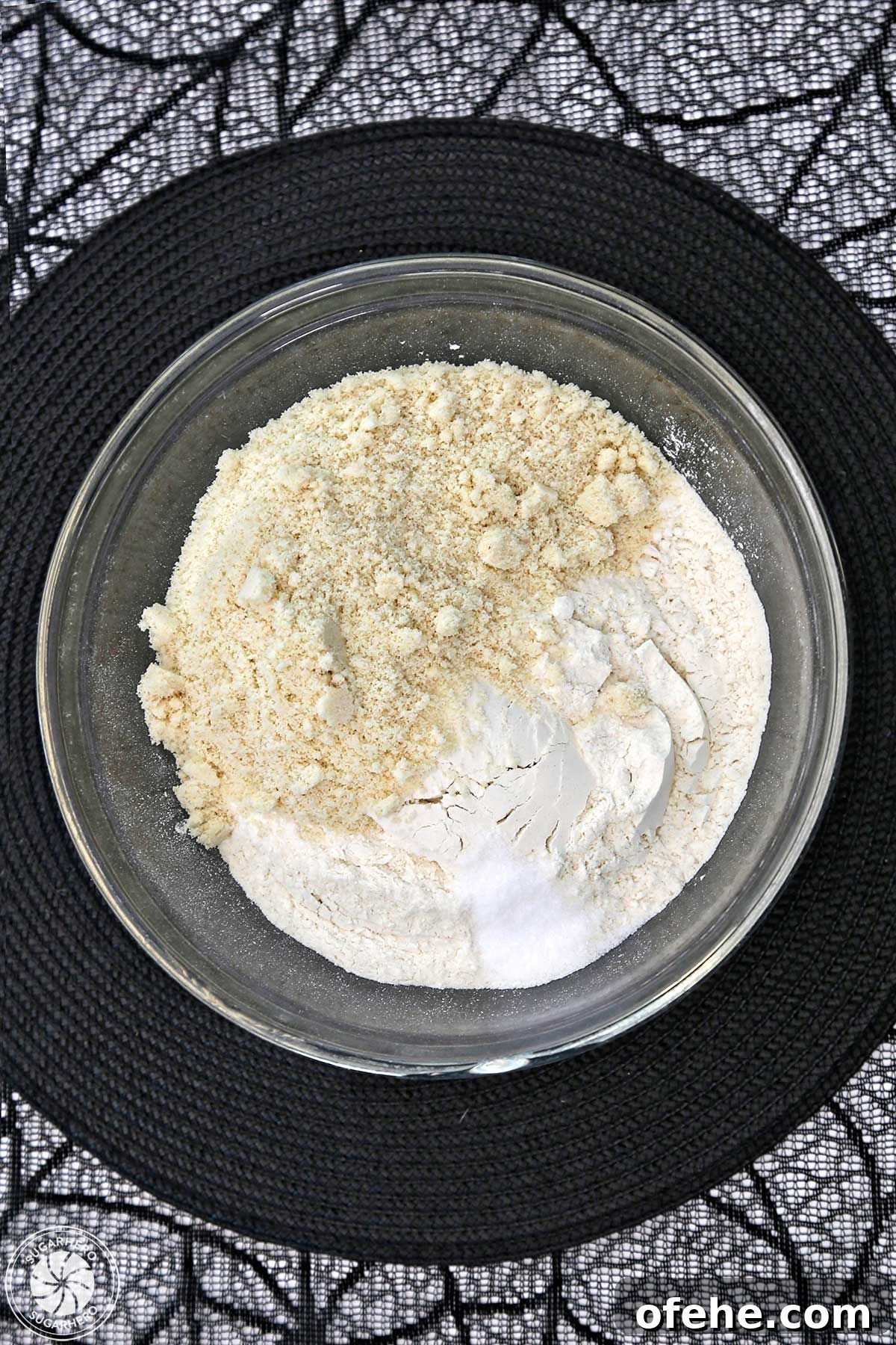 Spooky Witch Finger Cookie Recipe for Halloween Treats 15 Overhead shot of almond flour and regular flour in a glass mixing bowl.