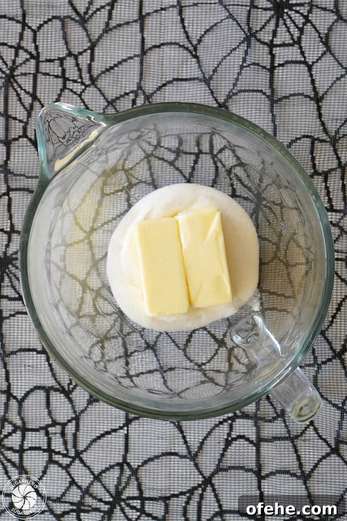 Spooky Witch Finger Cookie Recipe for Halloween Treats 16 Overhead shot of granulated sugar and 2 sticks of butter in a glass mixing bowl.