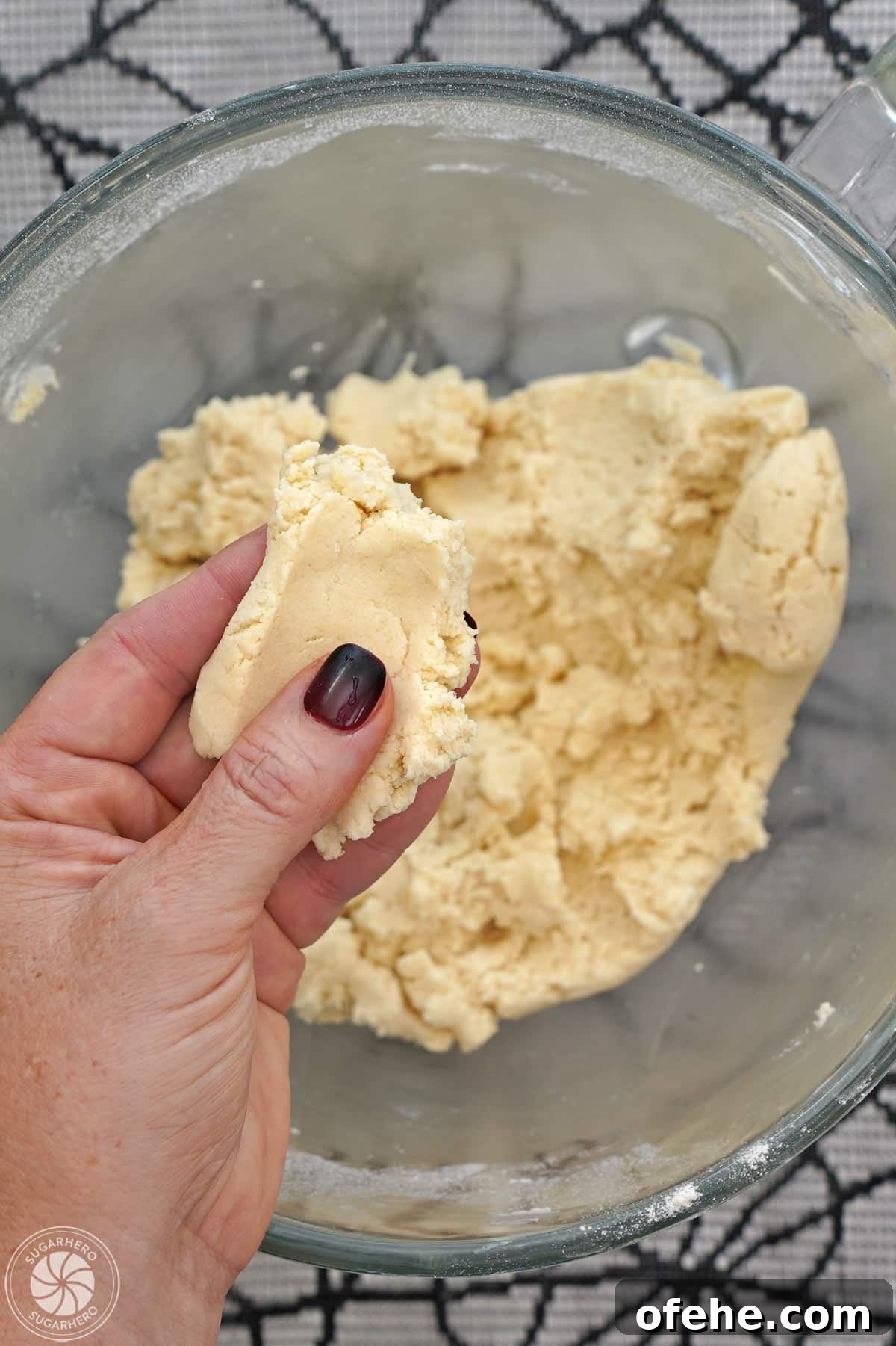 Spooky Witch Finger Cookie Recipe for Halloween Treats 19 Holding a handful of shortbread cookie dough to show the proper texture.
