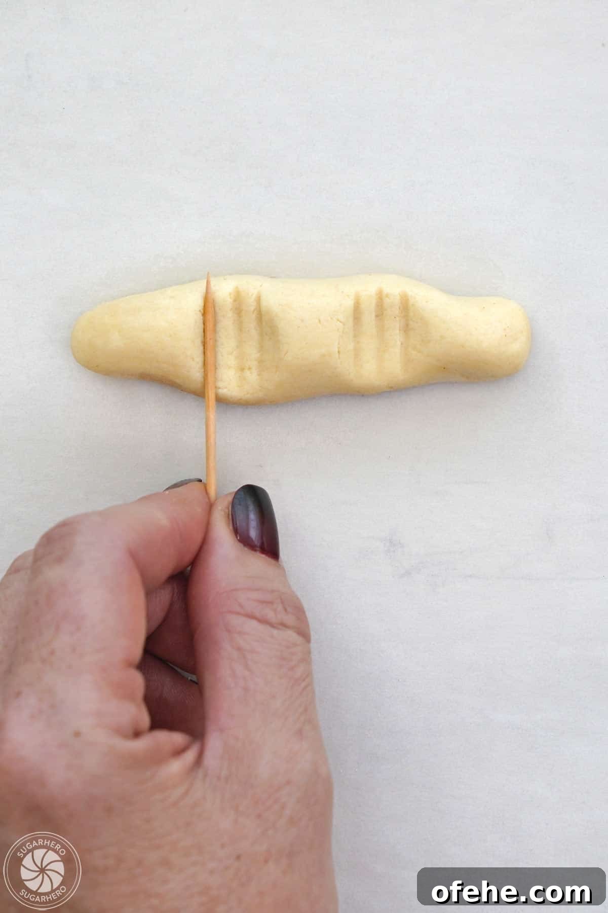 Spooky Witch Finger Cookie Recipe for Halloween Treats 21 Adding lines to the top of a witch finger cookie.