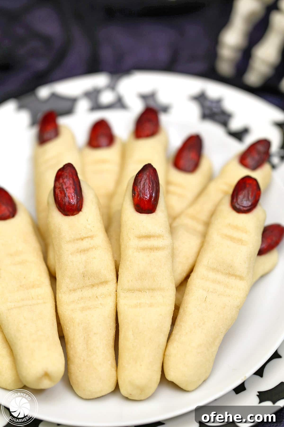 Spooky Witch Finger Cookie Recipe for Halloween Treats 23 Plate of Witch Finger Cookies with a black bat pattern on it.