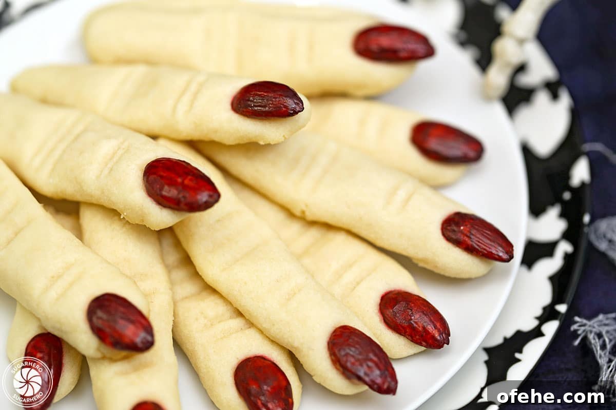 Spooky Witch Finger Cookie Recipe for Halloween Treats 4 Close-up of Witch Finger Cookies with red almonds for finger nails.