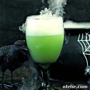 Spooky Witch Finger Cookie Recipe for Halloween Treats 5 Witch’s Brew Halloween Punch shown in a black cauldron with dry ice leaking out of the cauldron.