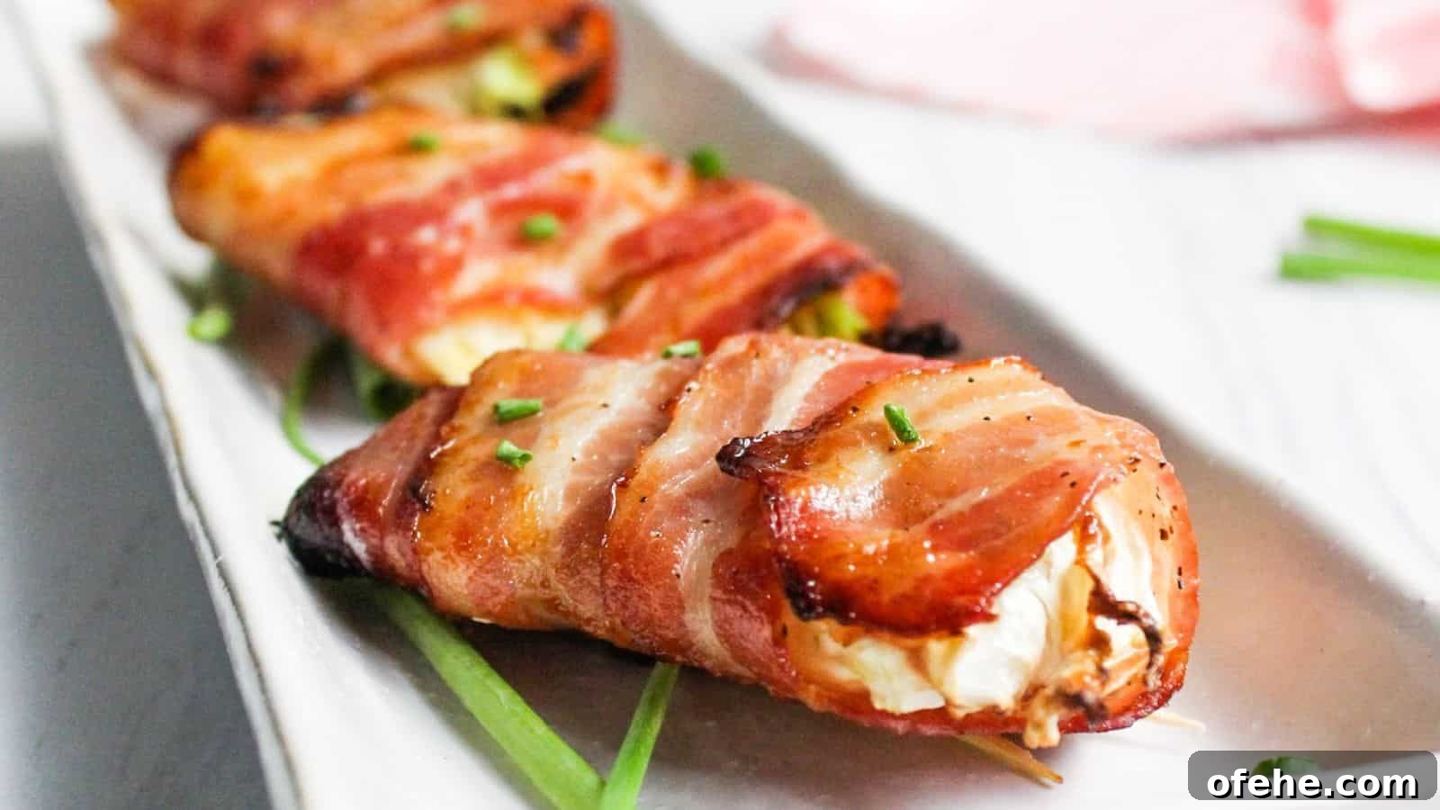30 Quick Appetizers to Impress Guests Without Fuss 11 Bacon wrapped air fryer cabbage on white plate.