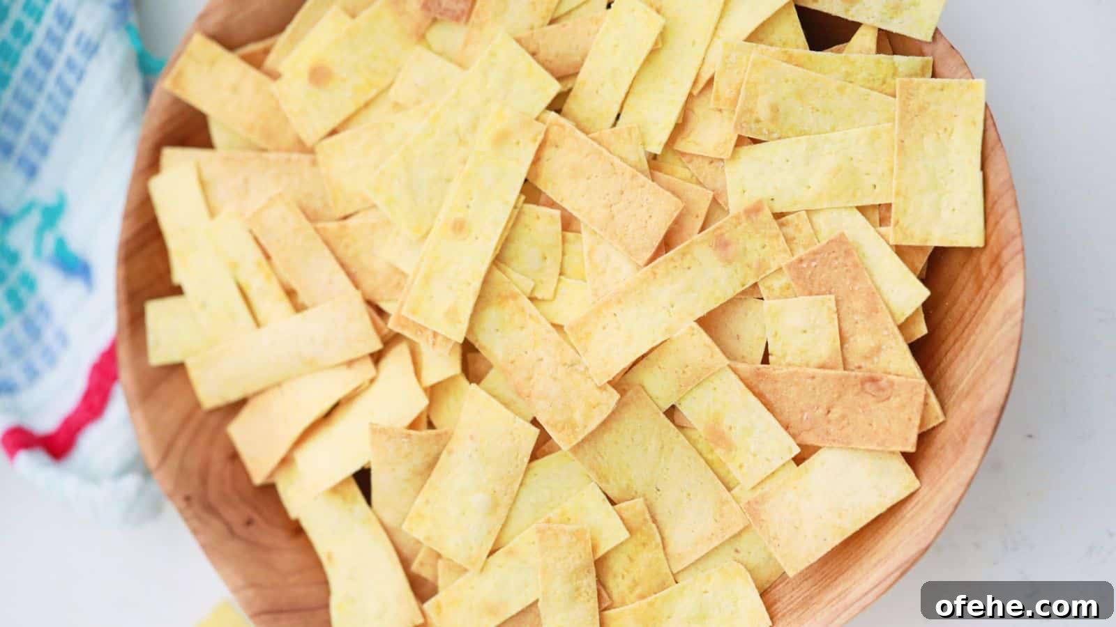 30 Quick Appetizers to Impress Guests Without Fuss 23 Tortilla strips in wooden bowl.
