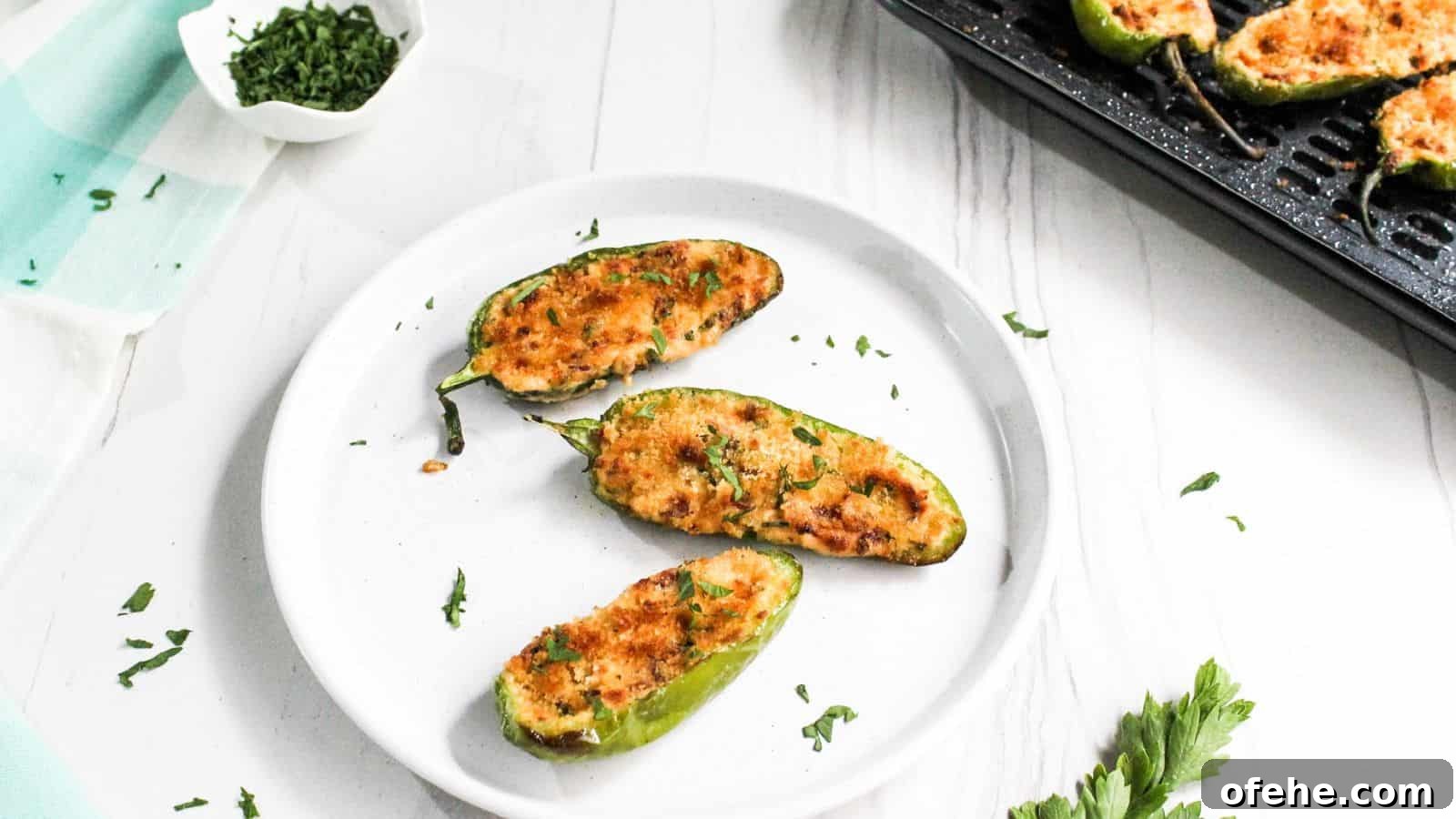 30 Quick Appetizers to Impress Guests Without Fuss 25 A plate of jalapeño poppers on a table.