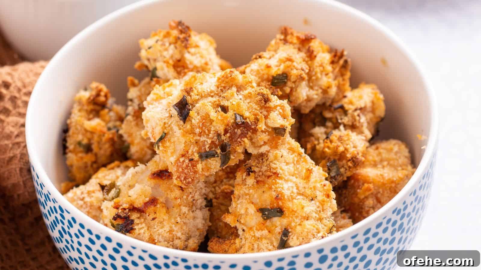 30 Quick Appetizers to Impress Guests Without Fuss 28 A bowl of golden brown popcorn chicken on a table.