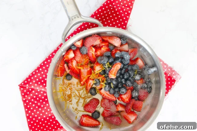 Fruit Compote Ideas: Delicious Pancake Toppers and More 4 Fruit compote in a pot before it is cooked.