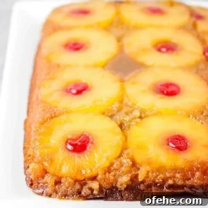 Homemade Pineapple Upside-Down Cake Recipe for Perfect Results 5 Homemade pineapple upside down cake from scratch on serving dish.