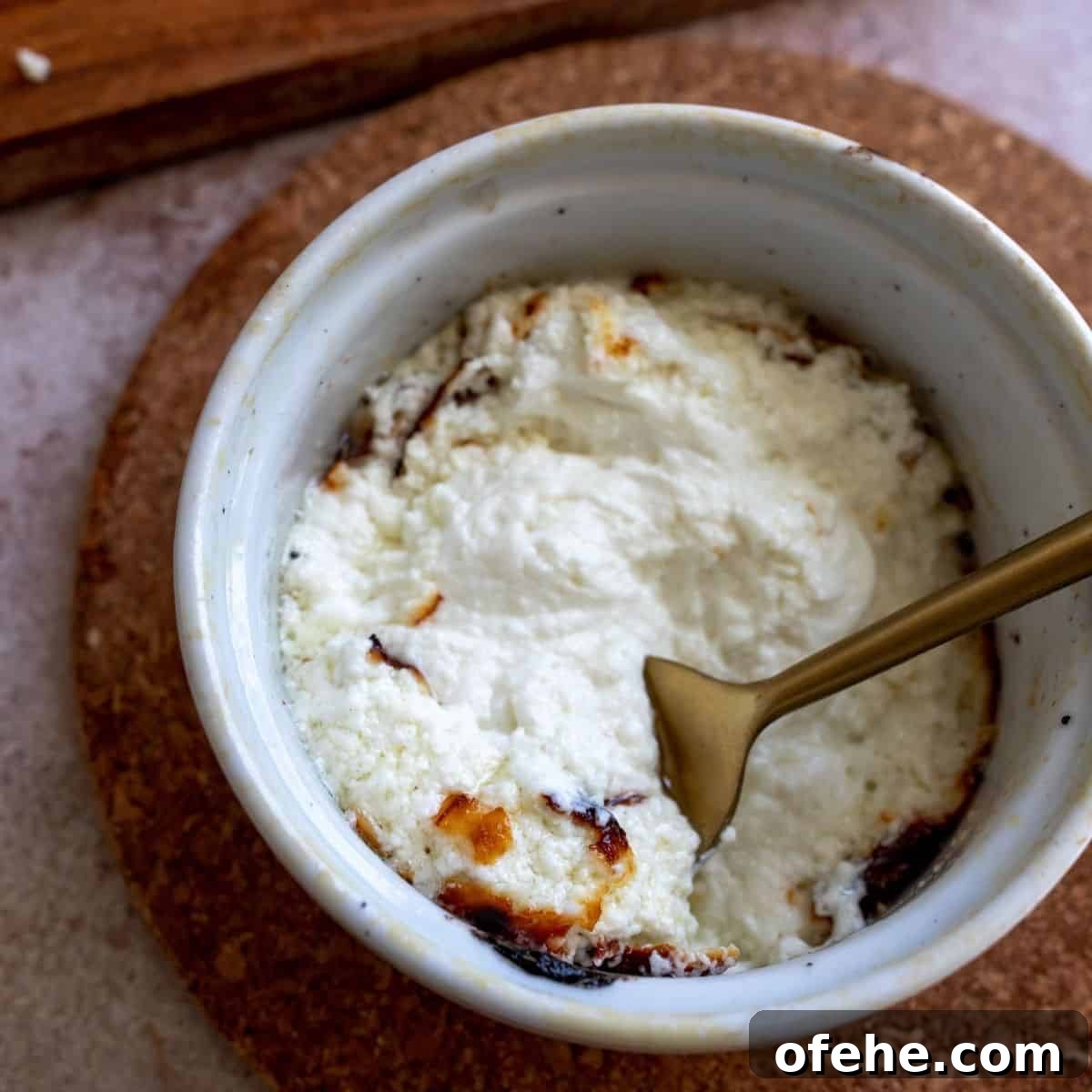 Creamy Baked Goat Cheese Dip with Honey and Herbs 5 Up close shot of the baked goat cheese.