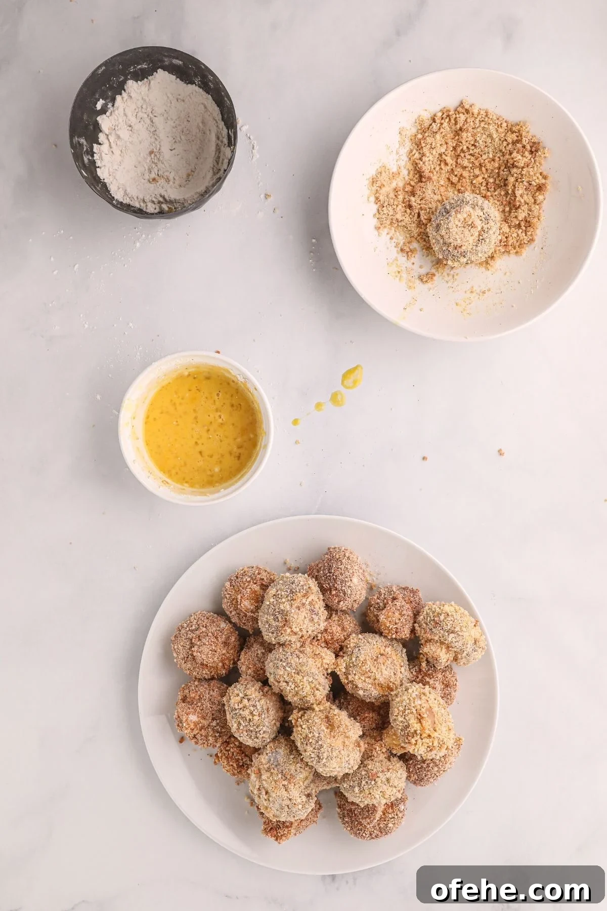 Crispy Air-Fried Mushrooms Recipe for Quick Snacks 5 Bowls with eggs, flour, and seasonings, showing mushrooms dipped in each before frying