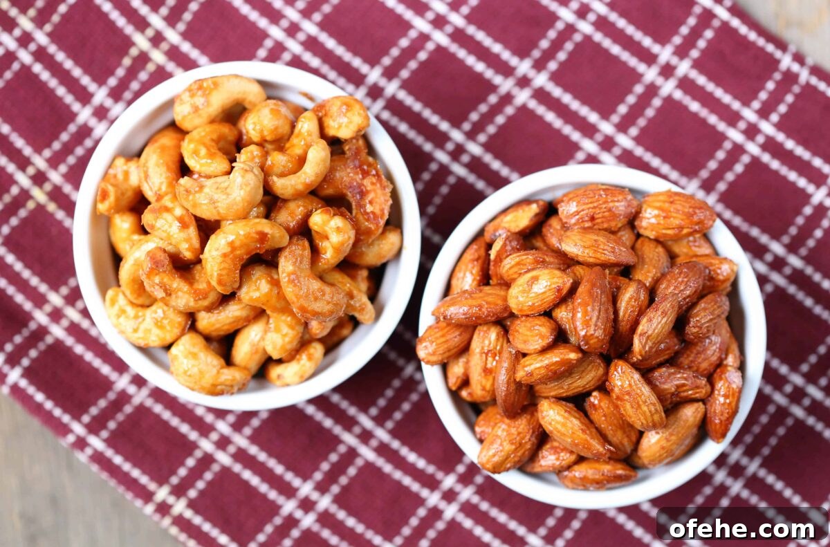 Maple Sriracha Roasted Nuts Recipe — Sweet-Spicy Snack Guide 3 two bowls of roasted nuts sitting on a burgundy tea towel.