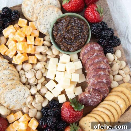 cheese cubes with crackers and jam.