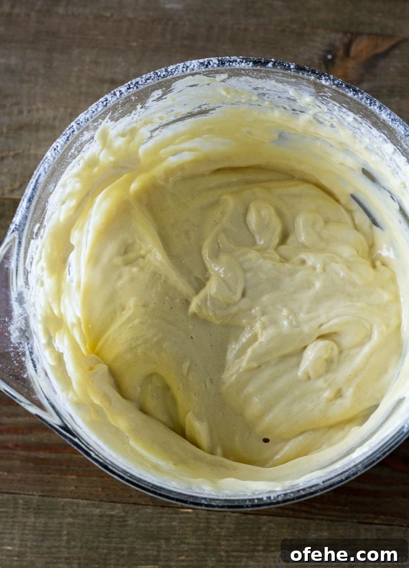 Classic Vanilla Sponge Cake Recipe for Light, Fluffy Layers 6 Vanilla Sponge Cake batter in a bowl.