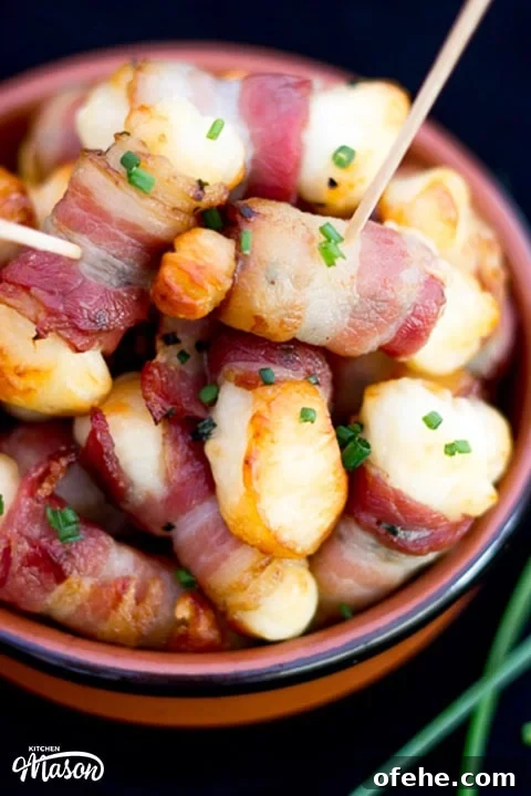 Crispy Bacon-Wrapped Halloumi Bites Recipe 6 Bacon Halloumi Bites in a serving dish with cocktail sticks