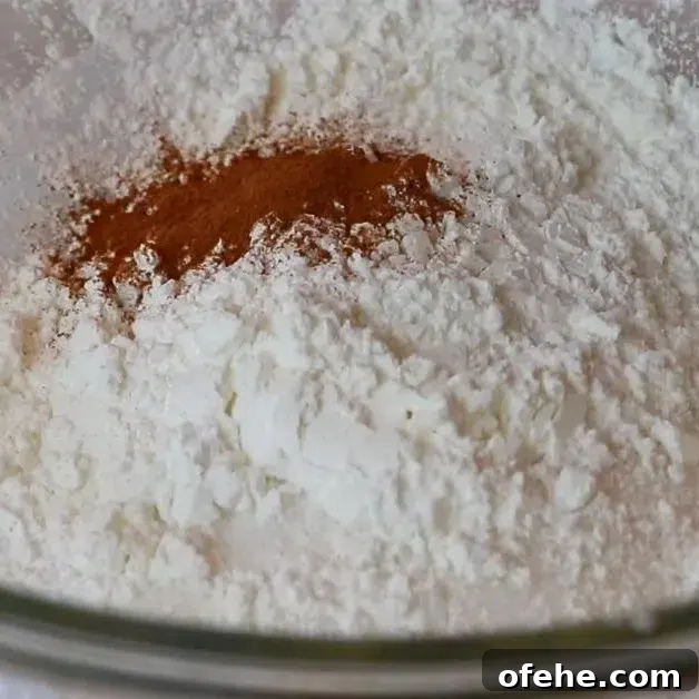 adding dry ingredients for blueberry pie filling