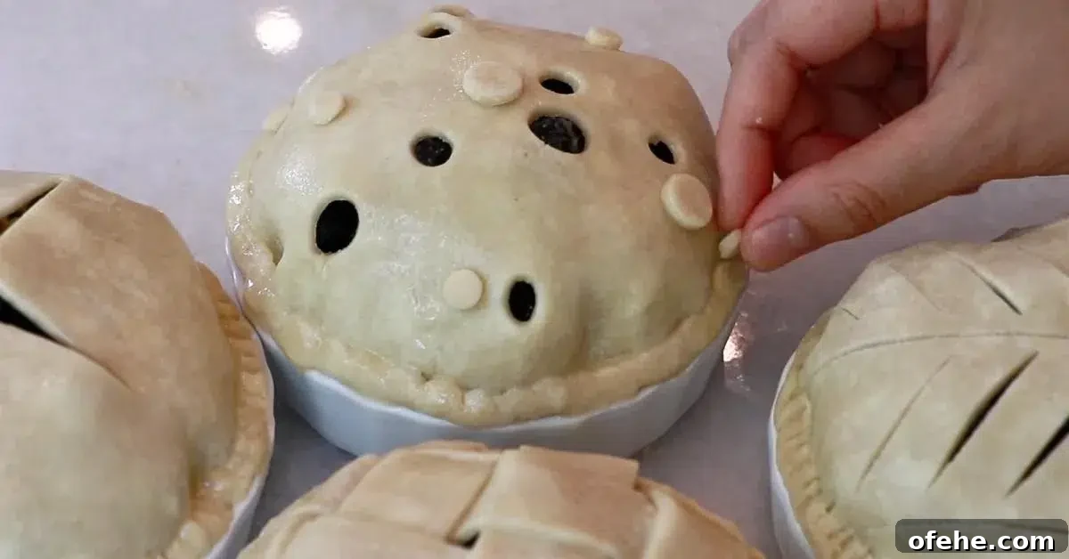 finishing assembling blueberry pies