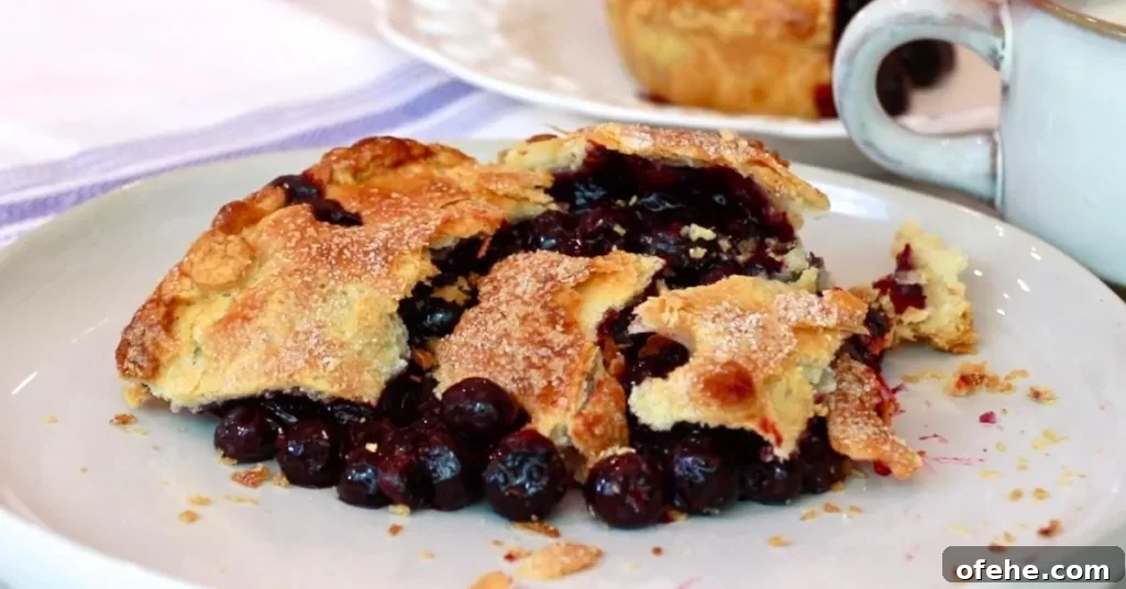 eating a small blueberry pie