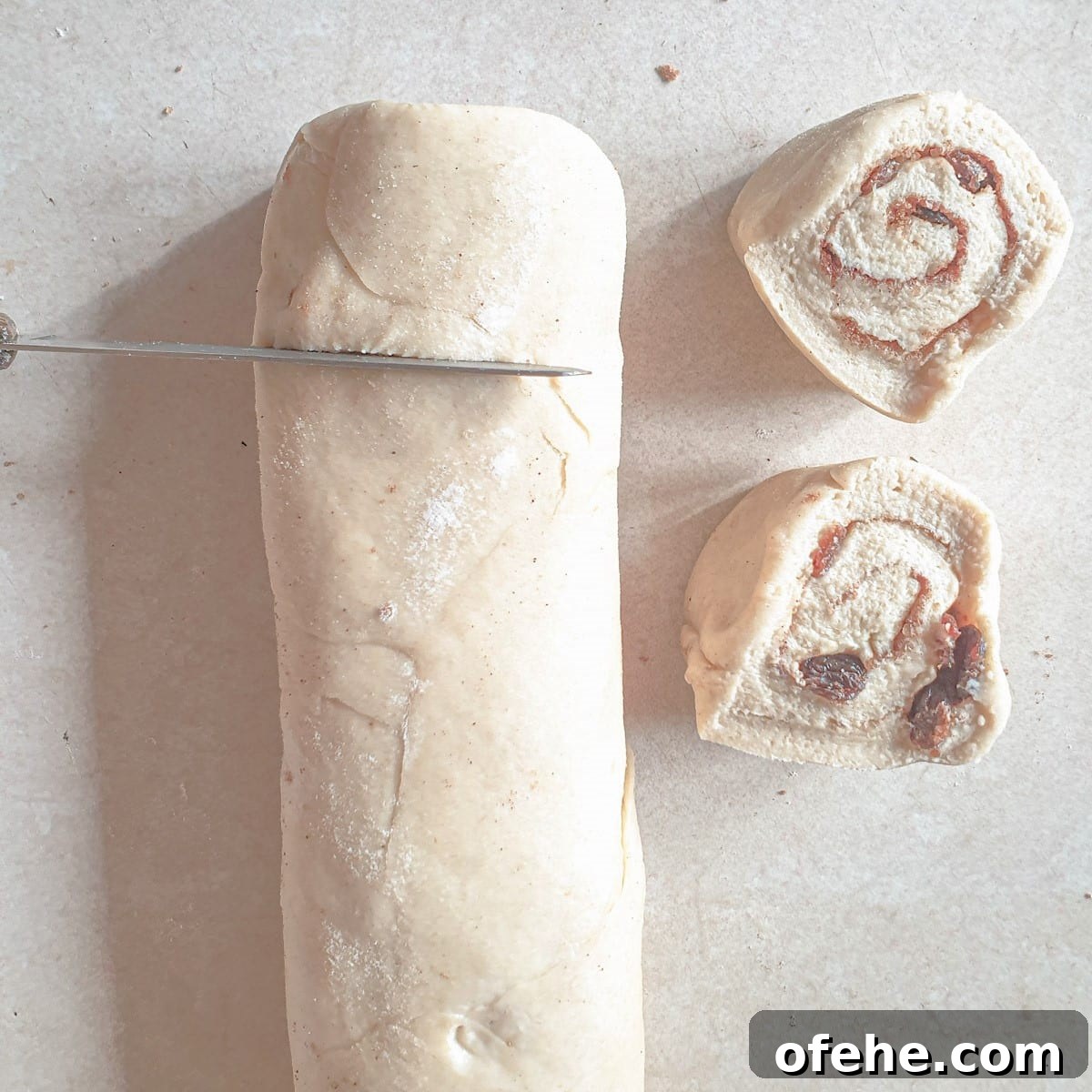 Homemade Chelsea Buns: Soft Cinnamon-Spiced Sticky Buns 15 Chelsea bun dough being cut into circles.