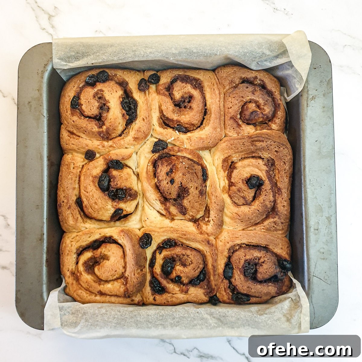 Homemade Chelsea Buns: Soft Cinnamon-Spiced Sticky Buns 18 A tray of chelsea buns after they have been baked.