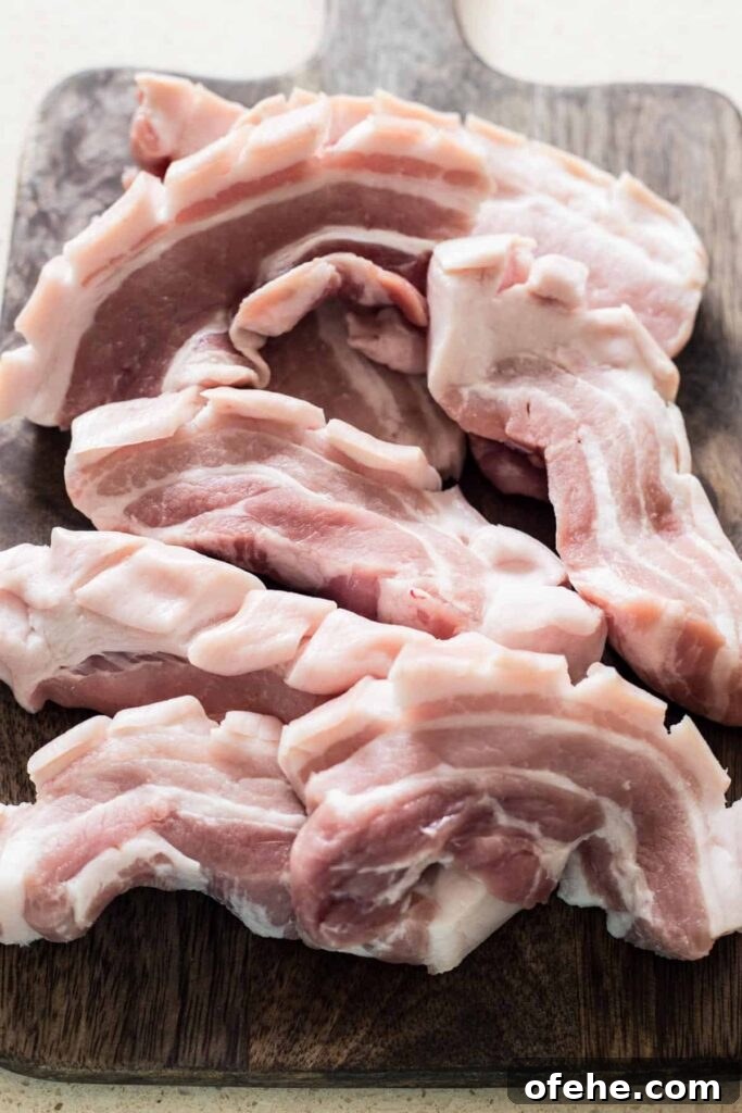 Raw Pork belly on a wooden board