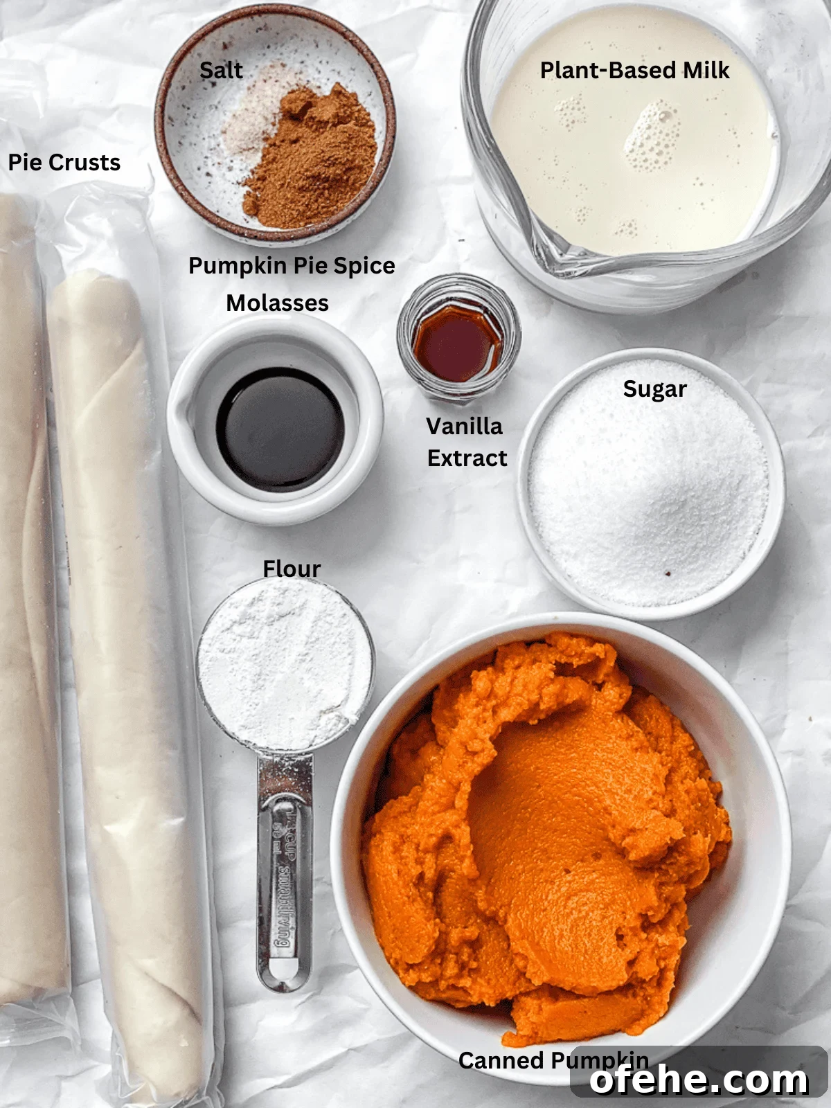 Mini Pumpkin Pie Recipe: Perfect Individual Fall Desserts 3 ingredients for Mini Pumpkin Pies measured out on a white surface