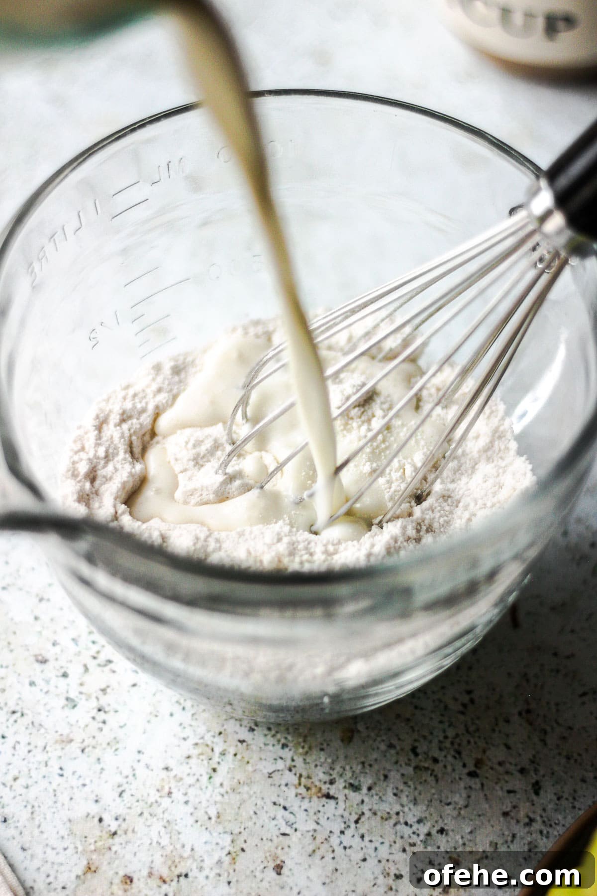 Classic Pear Cobbler Recipe: Warm, Berry-Free Dessert Tutorial 7 Milk poured into dry ingredients for pear cobbler.