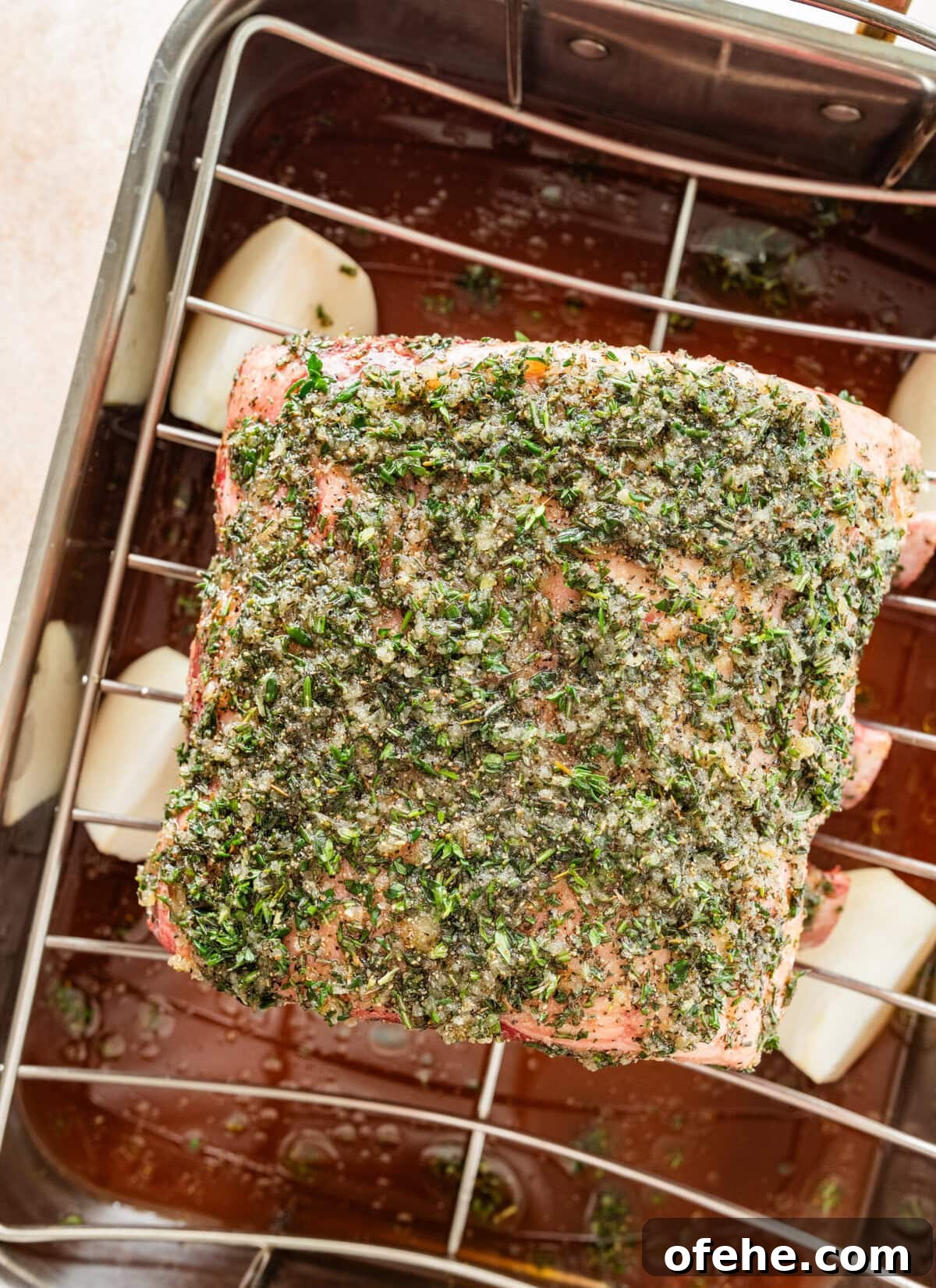 Garlic Herb Crusted Prime Rib Rub: Savory Seasoning Blend 10 standing prime rib roast in the roasting pan before roasting.
