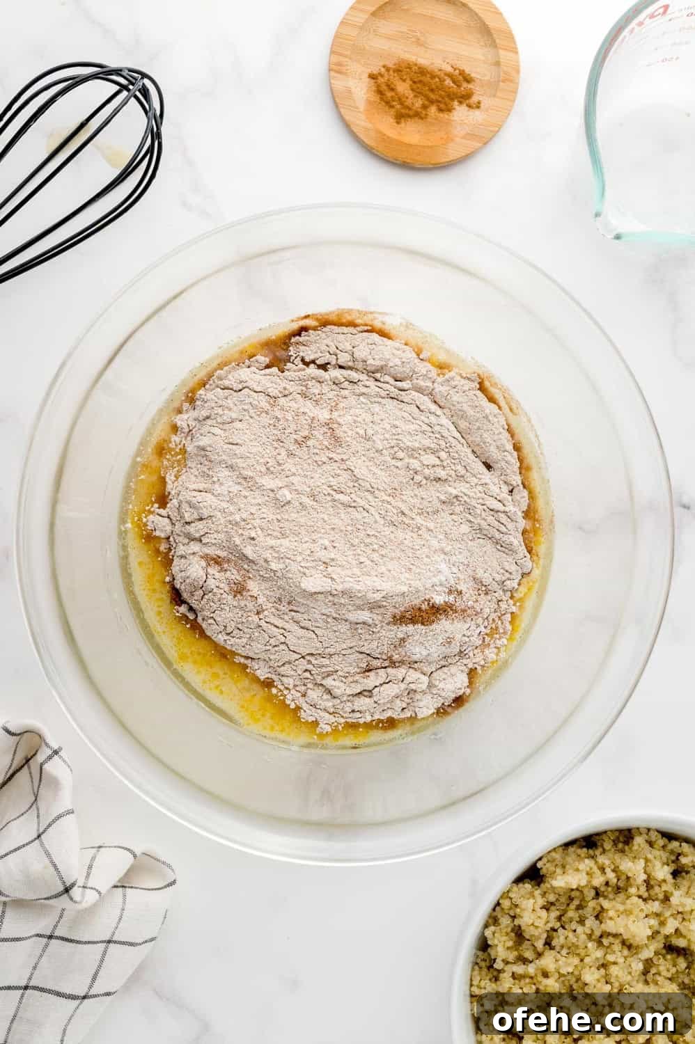 Apple Quinoa Pancakes That Crisp Up Perfectly 7 Dry ingredients on top of wet ingredients, not yet mixed in.