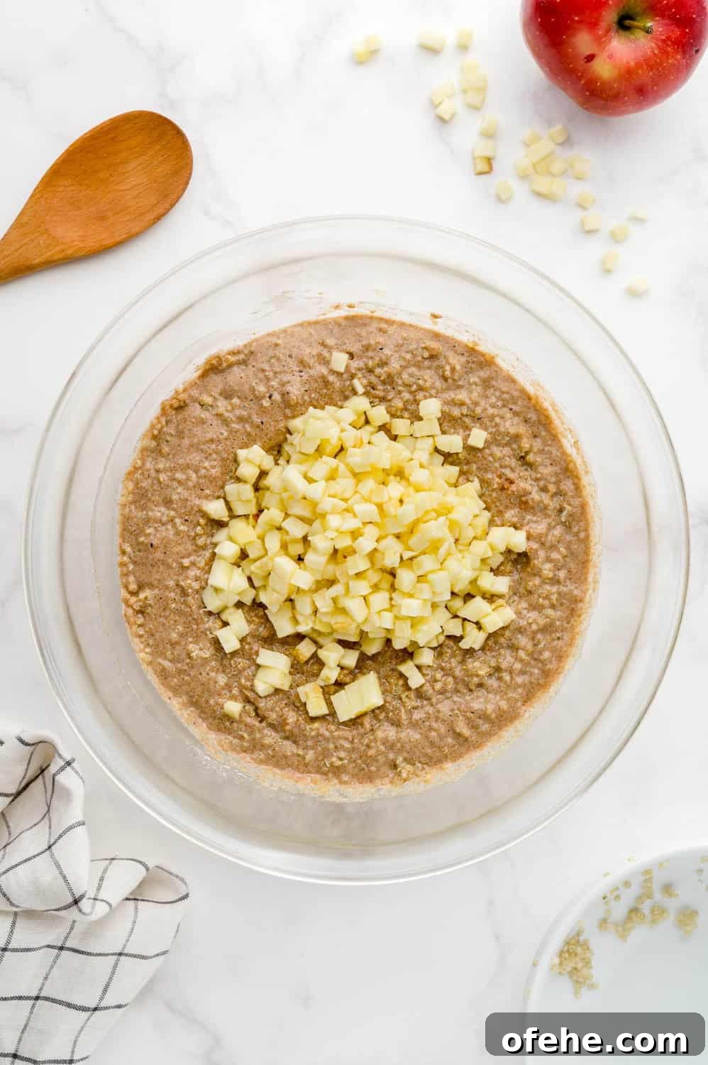 Apple Quinoa Pancakes That Crisp Up Perfectly 10 Apples added to batter, not yet mixed in.
