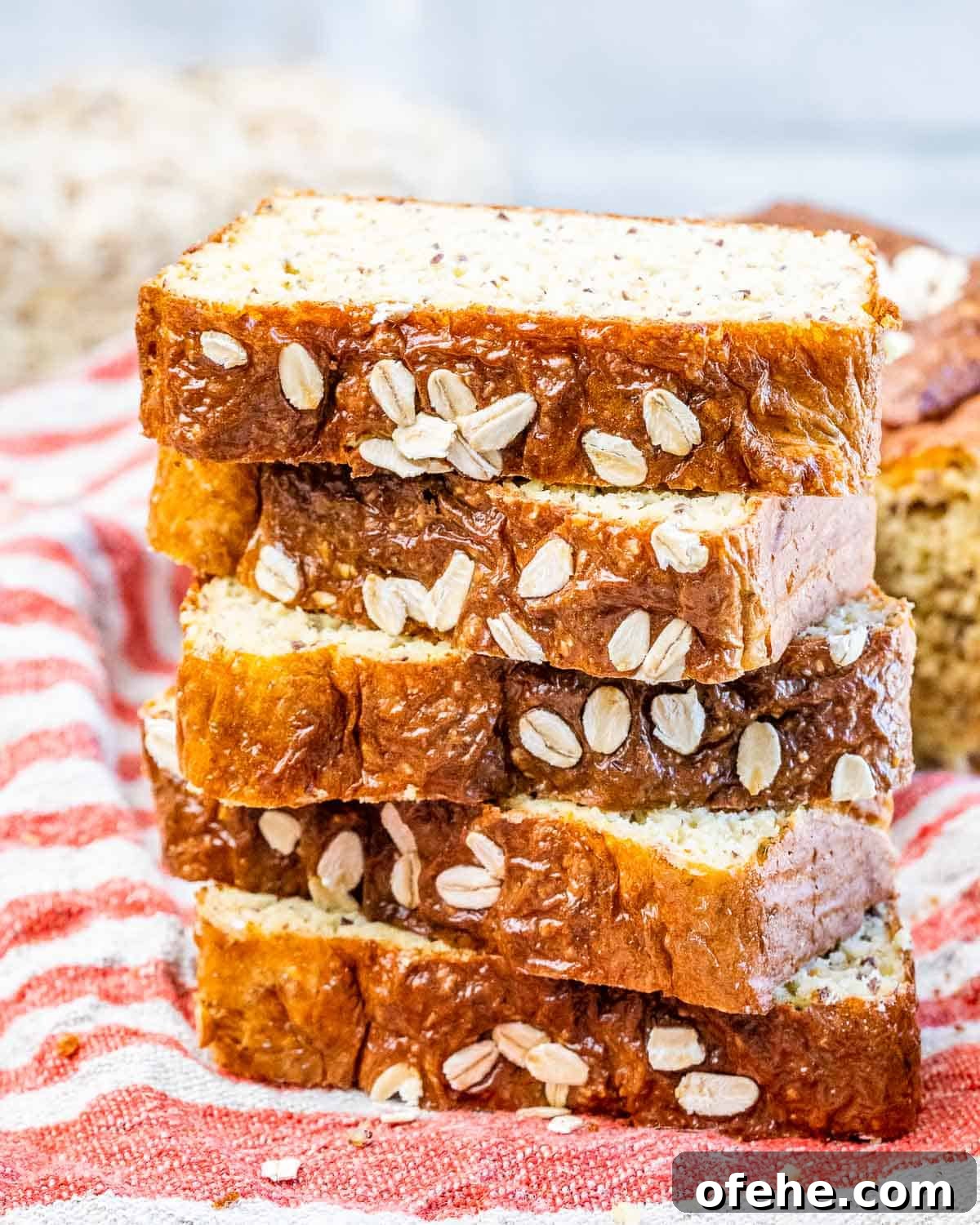Cottage Cheese Loaf Recipe: Soft, Tangy Homemade Bread 2 5 slices of cottage cheese bread stacked over each other on a colorful towel.