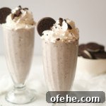 Oreo Milkshake Recipe: How to Make It with a Ninja Creami 7 two glasses filled with oreo milkshake