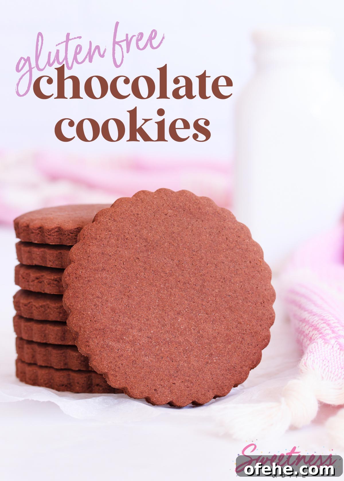 Stack of scalloped-edge round gluten free chocolate cookies, with one cookie resting on its side against the stack.