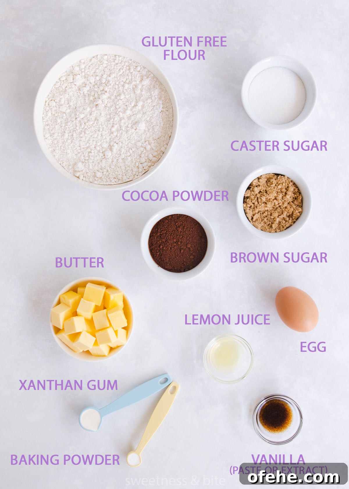 The gluten free chocolate cookie ingredients, in bowls on a grey background.