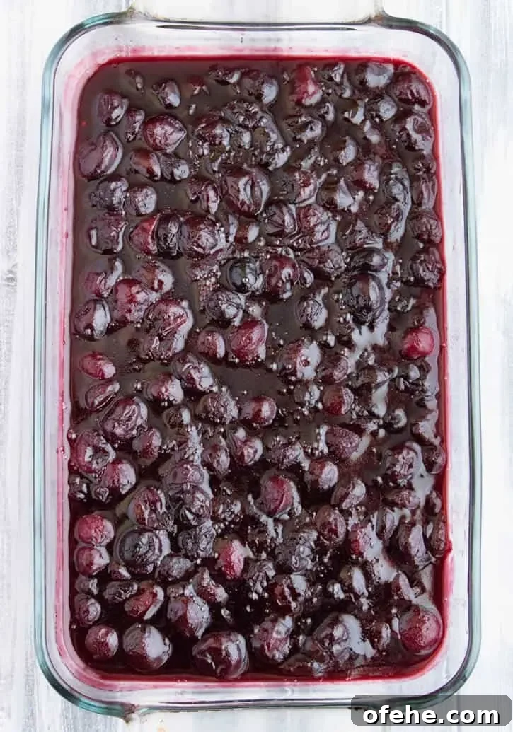 Cherry Sugar Cookie Cobbler Recipe: Sweet Cherry Dessert with Crumb Topping 5 Sugar Cookie Cherry Cobbler. Sweet, juicy cherries bake beneath a tender, yet crispy crust of buttery sugar cookies. A fun twist on traditional cobbler.