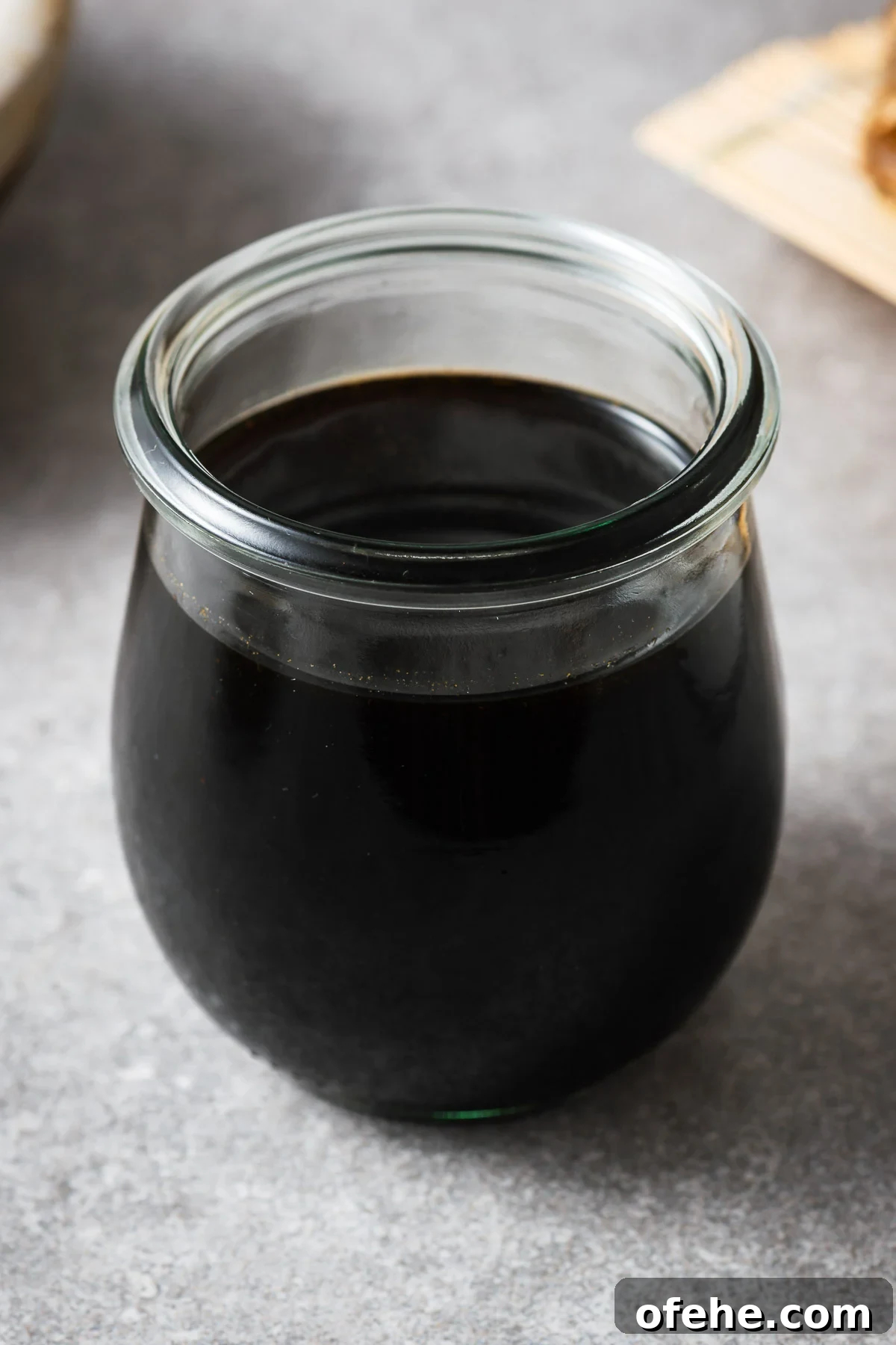 A glass jar with mentsuyu (Japanese soup broth concentrate).