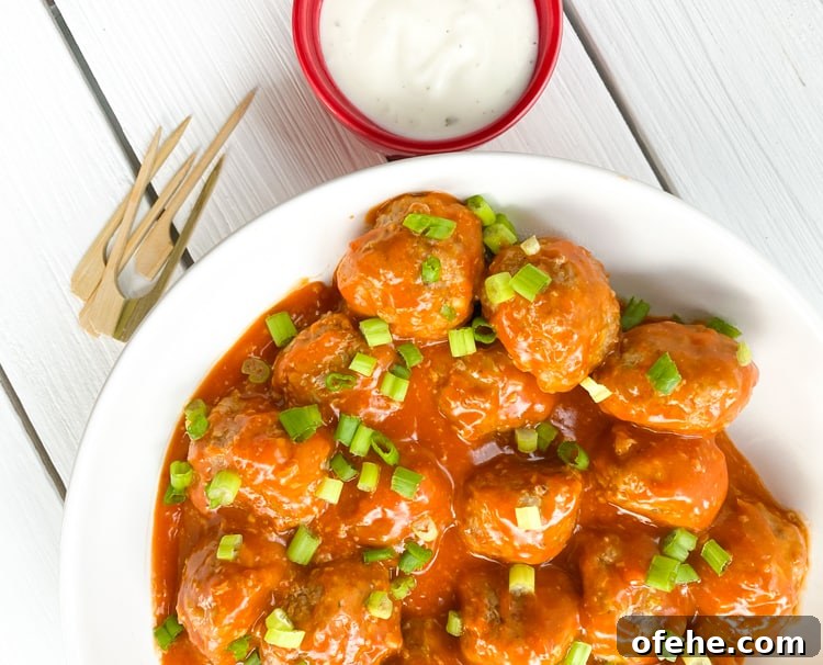 buffalo chicken meatballs with a side of blue cheese and skewers.