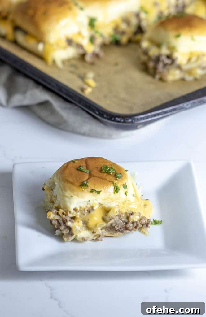 Cheesesteak sliders on Hawaiian rolls.