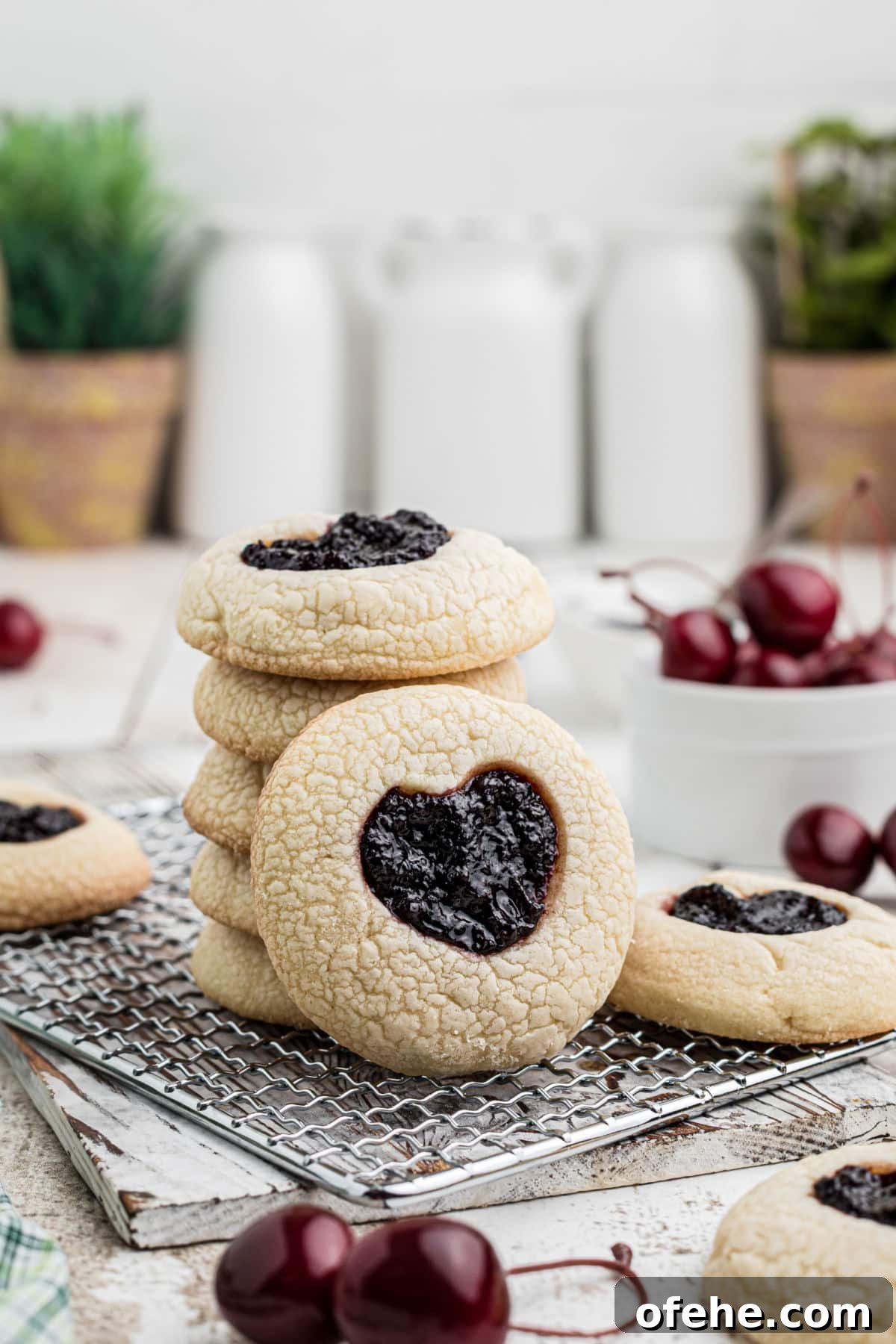 TikTok-Inspired Jam Heart Cookies Recipe 4 A stack of tiktok jam heart cookies with one standing up leaning against the stack.