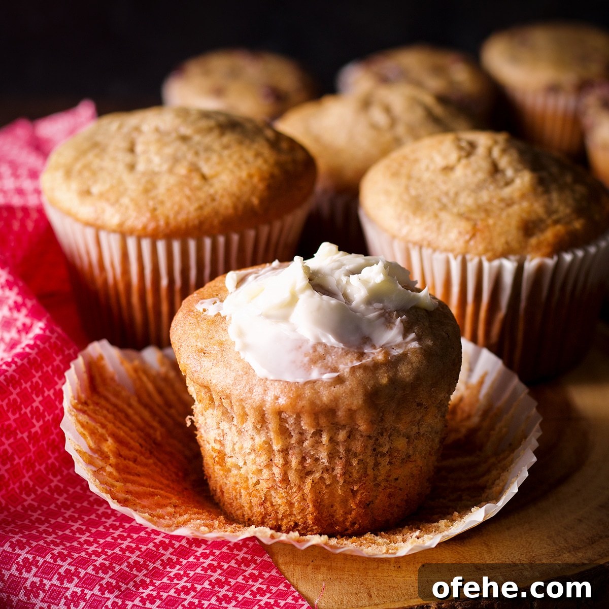 A jumbo size gluten free banana muffin slathered with butter.