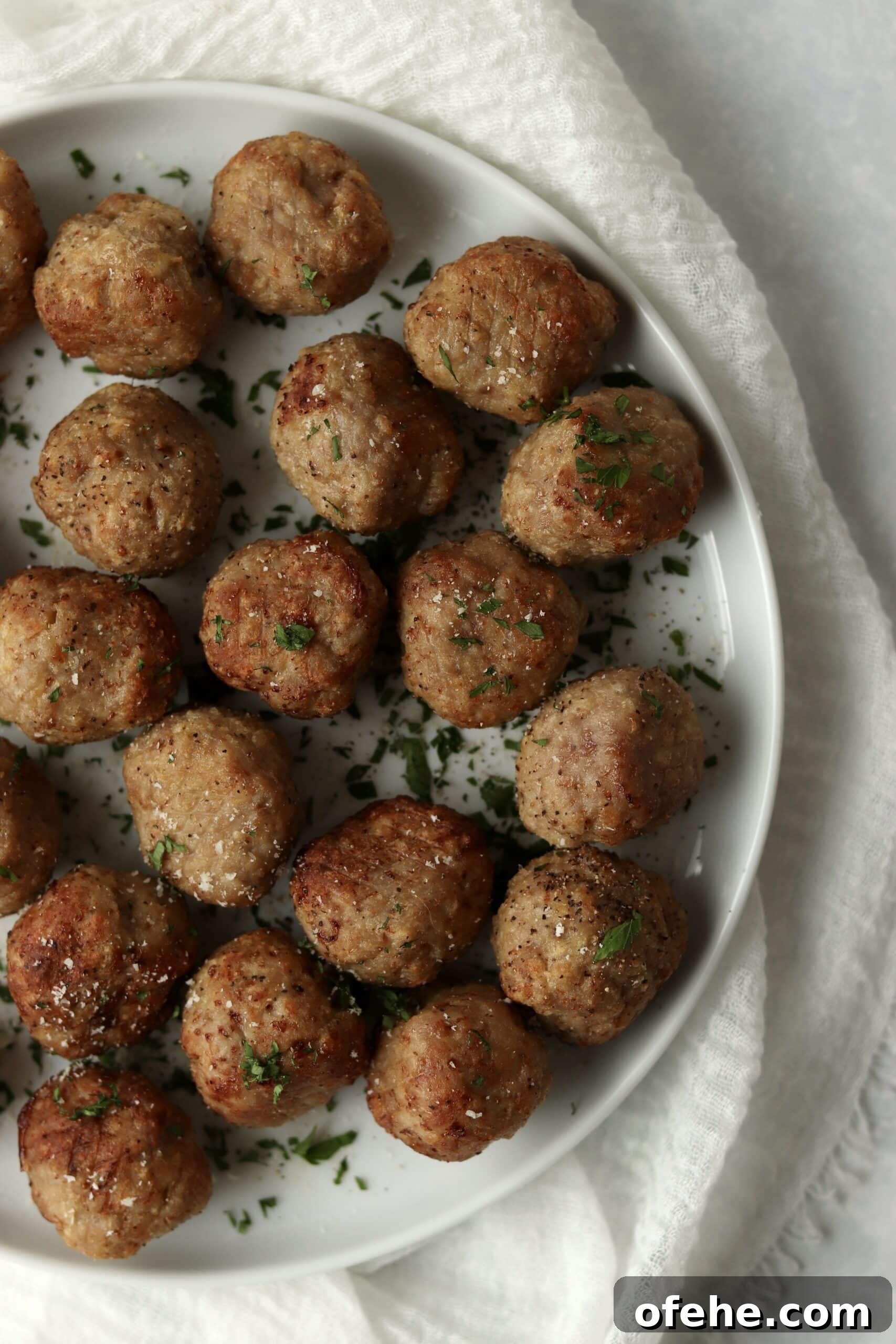 Crispy Air Fryer Turkey Meatballs Recipe for Quick Dinners 12 air fried turkey meatballs sprinkled with parmesan and parsley