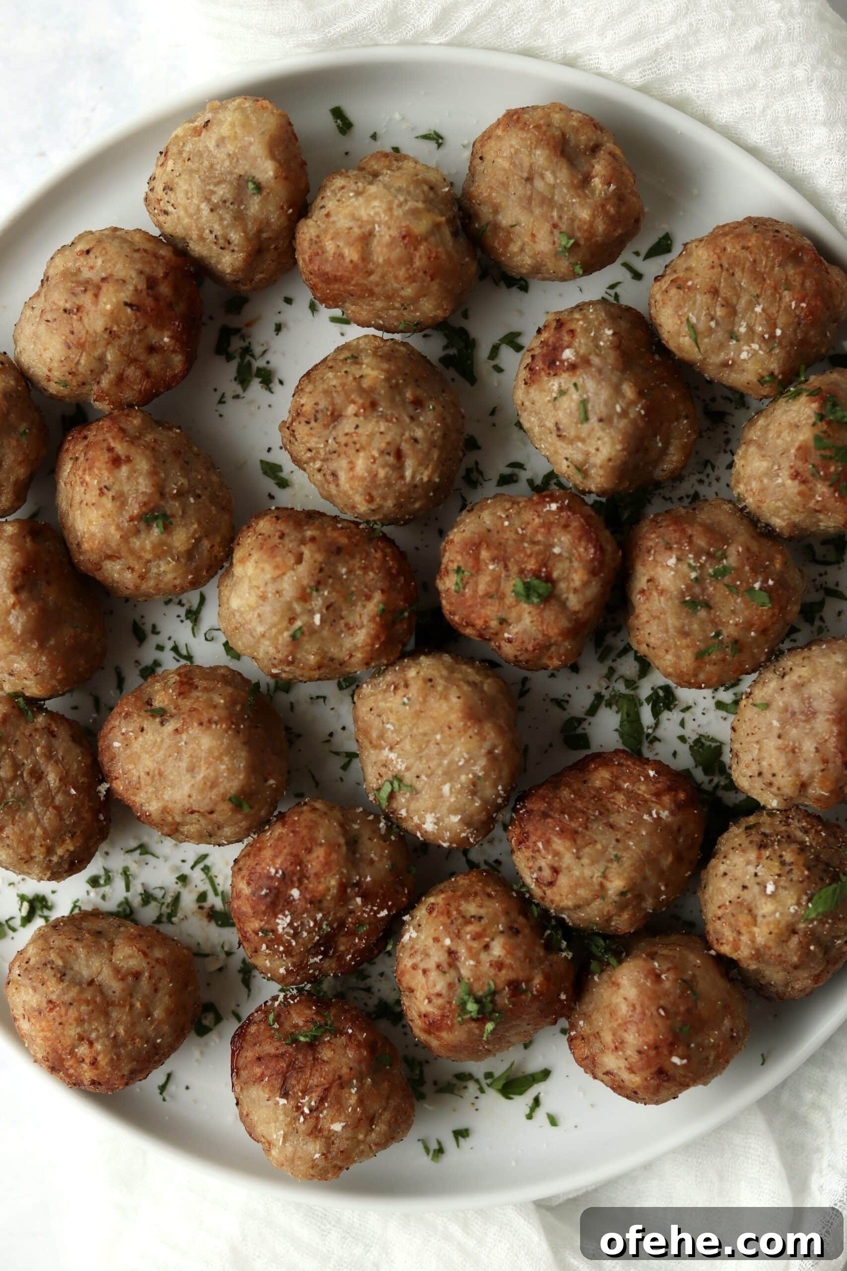Crispy Air Fryer Turkey Meatballs Recipe for Quick Dinners 10 cooked turkey meatballs on a plate