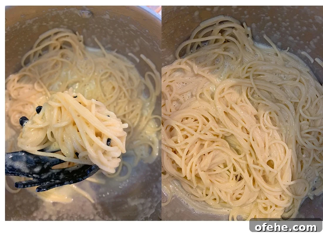 A pot full of spaghetti and slightly cooked carbonara sauce.