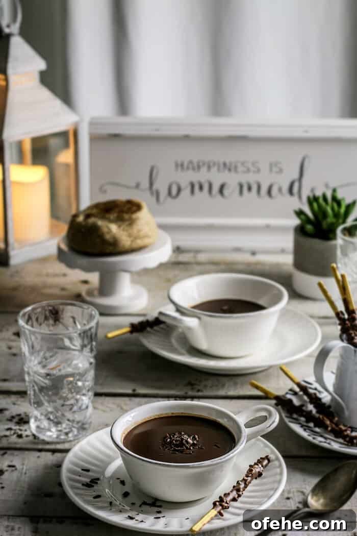 A rustic table setting with cups of hot chocolate.