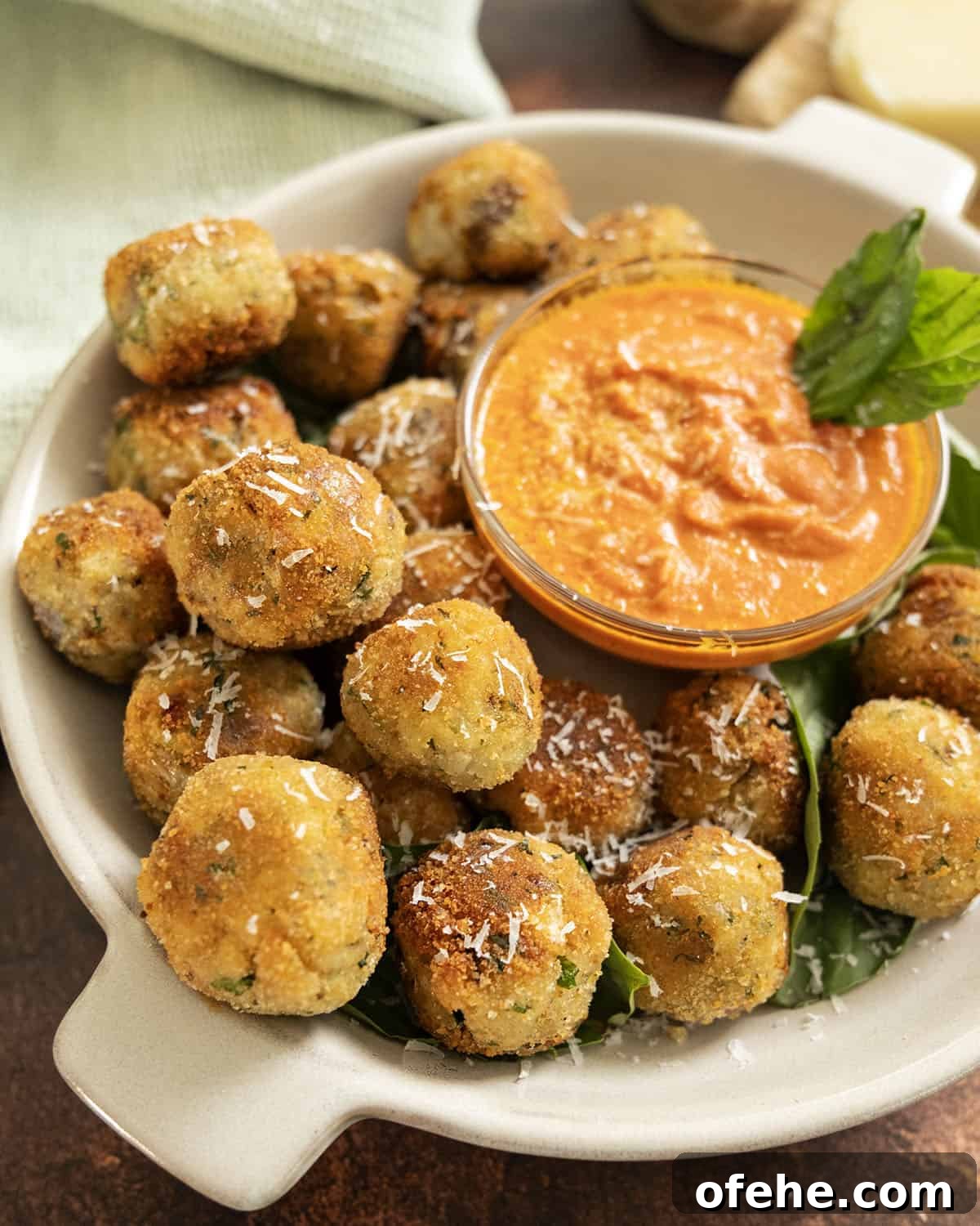 Italian Eggplant Meatballs in Tomato Sauce 2 Polpette di Melanzane or eggplant meatballs in a bowl with sauce.