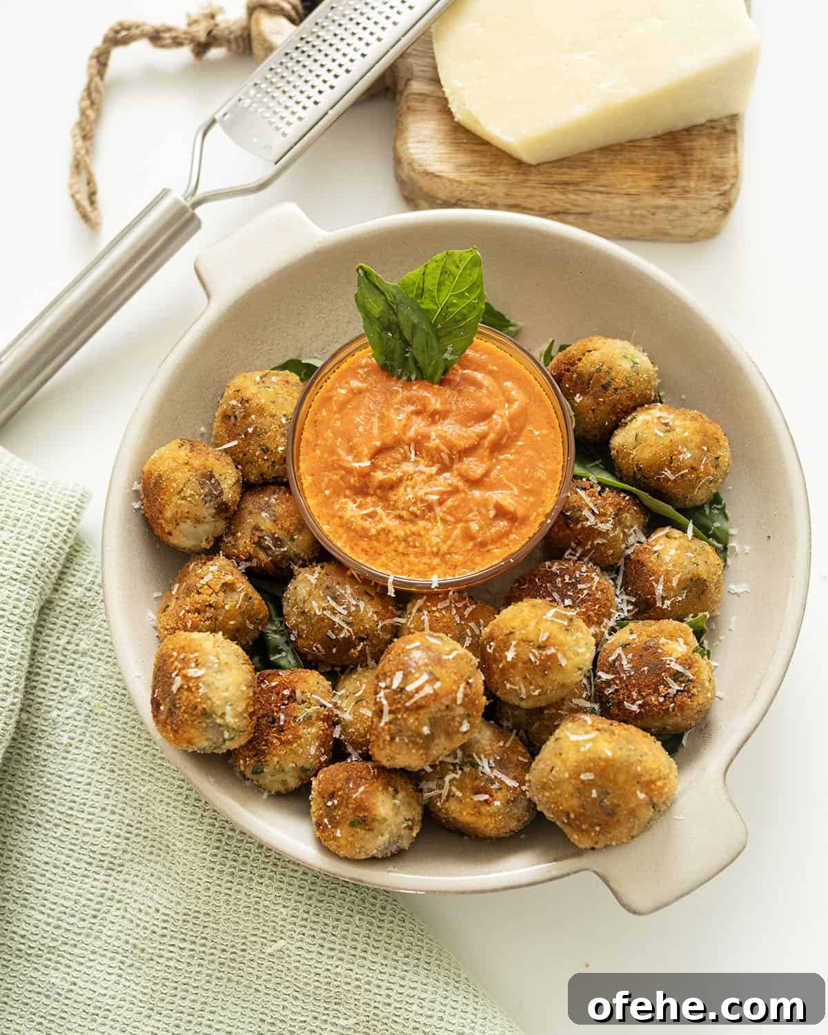 Italian Eggplant Meatballs in Tomato Sauce 12 Polpette di Melanzane or eggplant meatballs in a bowl with sauce.